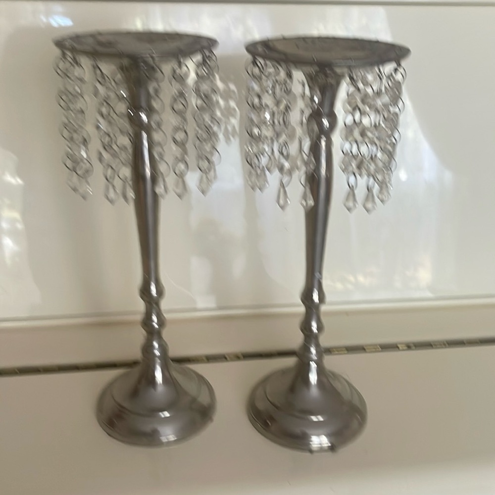 Two silver collar candlestick with crystal suspensions are very beautiful